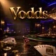 Vodds online casino hero banner with gold chips, playing cards, ruby dice on dark marble under cinematic casino lighting